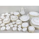 A Royal Worcester Gold Chantilly pattern dinner service to include cups and saucers, tureens,