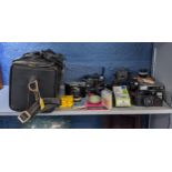 Photographic equipment and accessories to include a Nikon L35 AF a Zeiss Ikon, a Cosmic 35 and