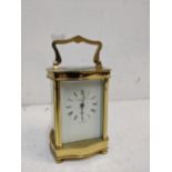 A late 20th century brass cased carriage clock, 5 windows, the face with retailer's Diamond Boutique