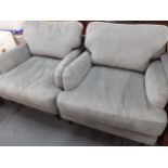 A pair of Swoon grey upholstered armchairs with cushion back and seat on turned legs Location: ROS