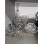A quantity of cut table glass to include a claret jug, four early 20th century enamelled glasses,