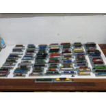 A large collection of Del Prado model trains, partially held within a metal case Location: