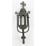 A Gothic Revival wrought iron lantern, of hexagonal form with arched openings, surmounted with fleur