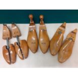 Three pairs of vintage shoe stays with printed initials to include walnut examples, approx 10" front