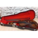 A late 19th century violin, approximately 14.5" from nose to lower bout, together with a bow and