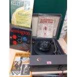 A mixed lot comprising a mid 20th century BSR record player, two albums of gramophone records (