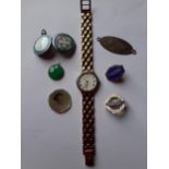 A ladies Tissot gold plated quartz watch K203 together with an Edwardian enamelled locket, a vintage