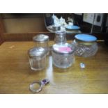 A group of glass and silver topped dressing table bottles, and a 925 silver pendant magnifying