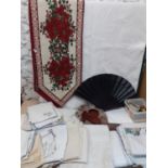 Vintage throws and table linen together with a pair of beaded mules, a black fan and a selection