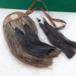 A London Scottish Strike Sure sporran with real horse hair on a leather pouch with silver coloured