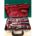 A Yamaha clarinet in case together with mixed sheet music and a Sony travel bag. Location:RWF