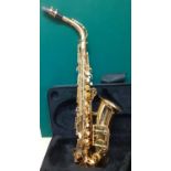 A Windsor gold tone Alto saxophone with additional boxed reed and a fitted case. Location:RWF