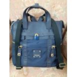 Henri Bendel, New York- A navy canvas and leather Jetsetter bag with detachable backpack straps