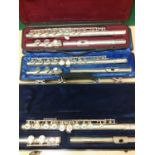 Two cased Yamaha silver tone flutes A/F together with a cased silver tone Lumiere flute. Location: