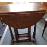 A 20th century reproduction oak drop leaf table in the 17th century style, 70cm h x 65cm w x 35cm