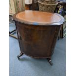 A reproduction mahogany oval leather topped cabinet on four lion paw feet, 69cm x 61cm Location: