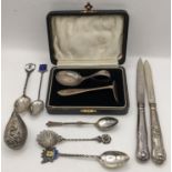 Mixed silver and white metal to include an enamelled teaspoon, 800 filigree spoon, boxed christening