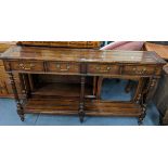 A reproduction hall table having four short drawers above six reeded columns and shelf below, 84cm h