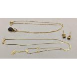 Gold jewellery to include two necklaces, a pendant and a pair of earrings Location: