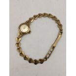 A vintage Avia 9ct gold manual wind wristwatch on a 9ct gold bracelet, 12.2g Location: