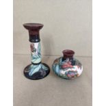 A Moorcroft red tulip vase signed WM to the bottom together with a Moorcroft candle stick, signed WM