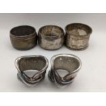 Five mixed white metal napkin rings to include a pair stamped Sargent 925, 149.3g Location: