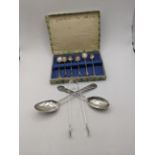 Silver to include a set of six unmarked coffee spoons, a Georgian spoon, a Rifle club spoon and