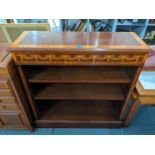 An Edwardian style mahogany and satinwood open bookcase on a plinth base, 92.5c, h x 91.5cm w