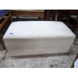 Early 20th century cream upholstered Ottoman, hinged lid, twin iron carrying handles 37cm x 97cm x