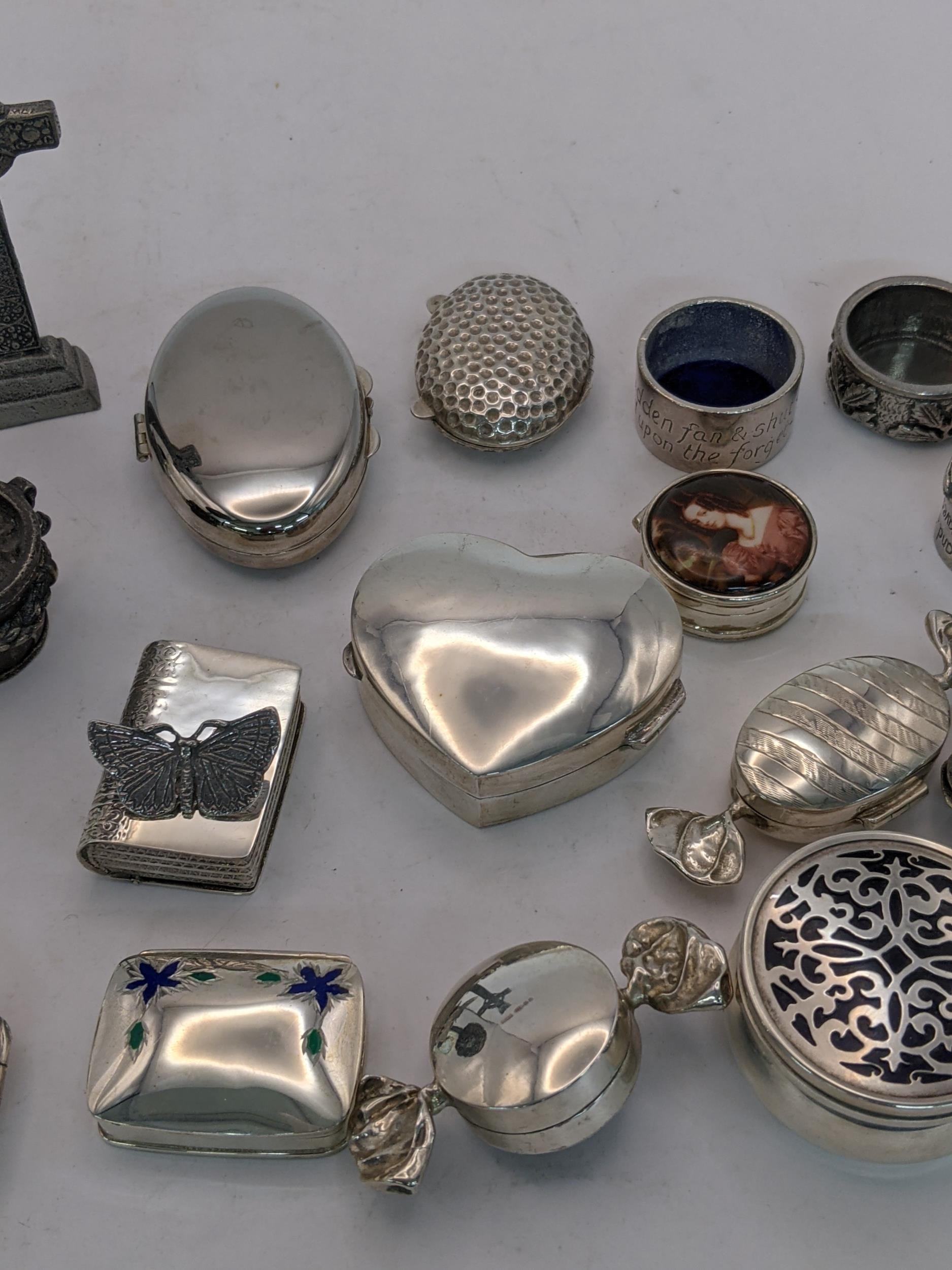 A collection of sterling silver and white metal pill boxes, also including a desk clock on an - Image 3 of 4