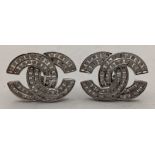 A pair of white gold ear studs set with diamonds, in an interlocking double Cs Location: