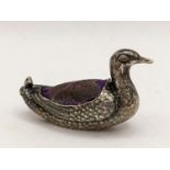 An early 20th century miniature silver pin cushion in the form of a duck by Sampson and Mordan,