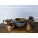 A group of Doulton stoneware and others to include a Doulton Lambeth Harvest pattern tyg with silver