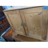 A 19th century pine cabinet with two doors on bracket feet 71cm h x 77.5cm w x 36.5cm d Location: