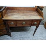 An early 19th century mahogany wash stand with three drawers on turned legs 30cm h x 94cm w