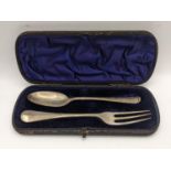 A matched silver Christening fork and rat tail spoon, in a fitted case, 80.2g Location: