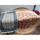 Two rugs, one with flora and foliage on a brown ground, and the other a cream ground Location: