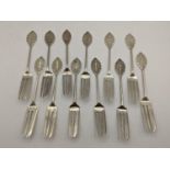 A set of twelve white metal South East Asian pastry forks, 129g Location: