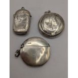 Two late 19th/early 20th century silver vesta cases together with a silver pill box, 42g Location: