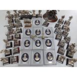 A collection of British military related ornaments to include Royal Hampshire plaques of generals, a