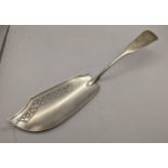 A silver fiddle pattern slice (marked SI) London 1807. 135.9g Location