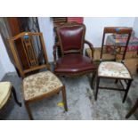 A reproduction red leather upholstered open armchair and two Edwardian mahogany inlaid side chairs