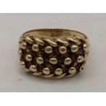 A 9ct gold gents ring of ball design, 9.3g Location: