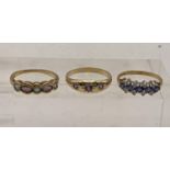 Three 9ct gold rings, one possibly amethyst trilogy gypsy ring, and two others, total weight 5.7g