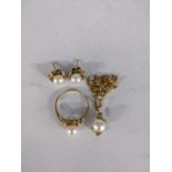 A gold suite of jewellery each set with pearls comprising a necklace, a pair of earrings and a