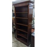 A contemporary mahogany open bookcase with five adjustable shelves on plinth base 216cm x 96.5cm x