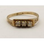 A 14ct gold three stone paste ring, 1.7g Location: