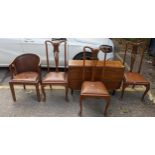 An early 19th century mahogany gateleg table together with three pierced splat back chairs and a tub