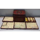 A mid century Mahjong set in a box with five graduated drawers and applied metal mounts Location:
