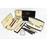 A collection of pens and lighters, to include a Cross matt bronze fountain pen in box, with chrome